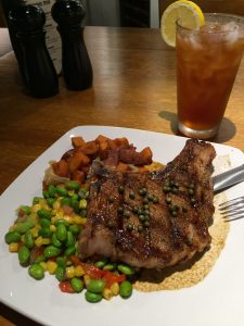 Postmasters Grill is serving a bone-in pork chop with edamame succotash in March.